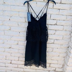Mini dress with criss cross back straps 0